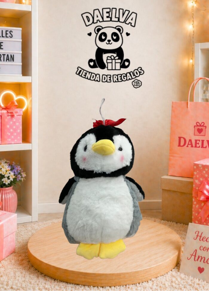 Peluche de pingüino con lacito rojo